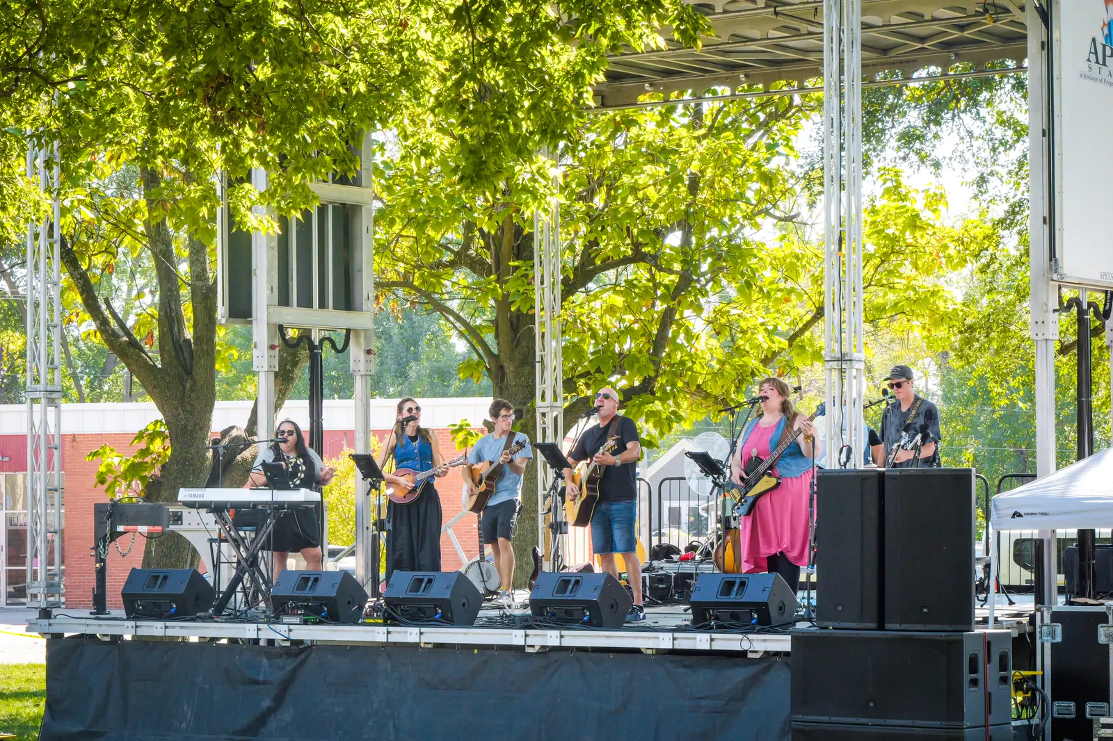 A worship band plays on the covered stage on the Humboldt Town Square.